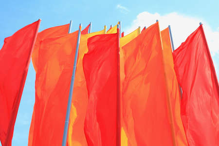 Flags colorful close-UPS on the background of the blue sky の写真素材