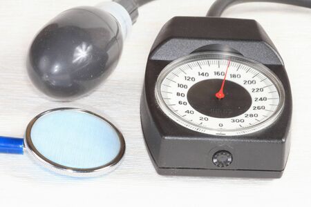 A pressure gauge, a phonendoscope health for measurement of blood pressure closeup on a light...