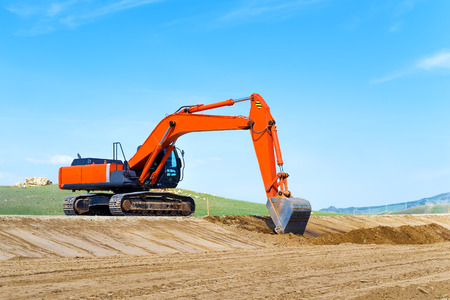 Excavator on the construction of a new road