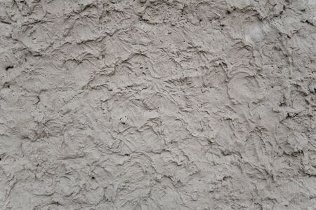 Rough cement plaster on the wall backgroundの写真素材