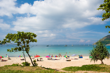 Tourists on Nai Harn beach on a sunny day, Phuket, Thailandの写真素材