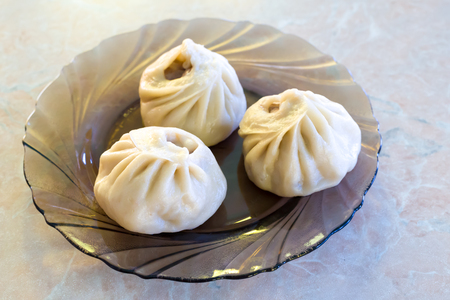 Buryat traditional dish of dough and minced meat, steamedの写真素材