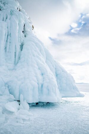 A huge block of ice hanging over the surface of Lake Baikal. Siberia, Russia.