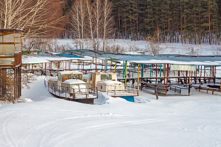 The river Split the Town of Berdsk, Novosibirsk oblast, Siberia, Russia - January 12, 2017: the snowy river and boat stationのeditorial素材