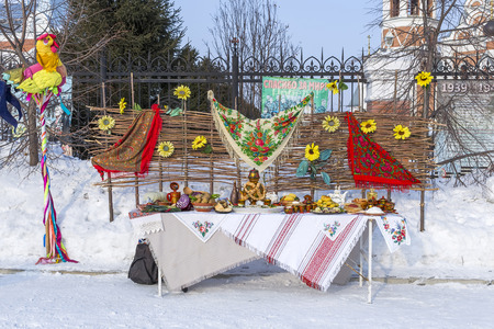 Berdsk, Novosibirsk oblast, Siberia, Russia - February 26, 2017: the table was laid with food on the street, in the carnival holidayのeditorial素材