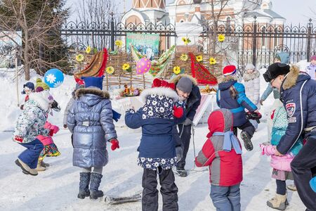 Berdsk, Novosibirsk oblast, Siberia, Russia - February 26, 2017: Russian holiday of Maslenitsa, national street festivities at the Churchのeditorial素材