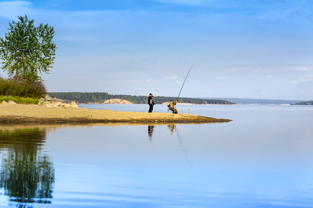 The river Berd, Novosibirsk oblast, Siberia, Russia - may 14, 2017: Fishermen on the banks of the river fishのeditorial素材