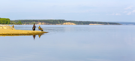 The river Berd, Novosibirsk oblast, Siberia, Russia - may 14, 2017: Fishermen on the banks of the river fishのeditorial素材