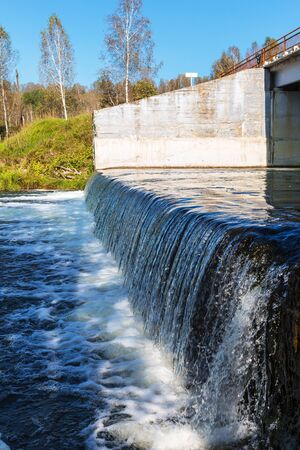 Road bridge over the river Suenga with a waterfall. Maslyaninsky district, Novosibirsk oblast, Siberia, Russiaの写真素材