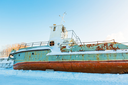 Berdskiy Bay, river Ave, Berdsk, Novosibirsk oblast, Siberia, Russia - January 2, 2018: the old tow boat on the shoreのeditorial素材