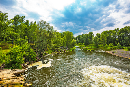 Working village Suzun, Novosibirsk region, Western Siberia, Russia-July 21,2018: Lower Suzun river flowing through the villageのeditorial素材
