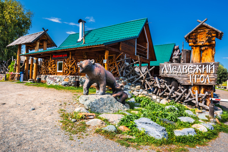 Camp site corner of the bear, Aya Village, Gorny Altai, South Siberia, Russia-August 25, 2018: sculpture of bears at the entrance to the recreation centerのeditorial素材