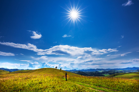 Altai mountains, southern Siberia, Russia-August 25, 2018: tourist on the background of Altai mountains and hills under the scorching mountain sunのeditorial素材
