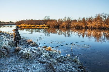 Chik river, Kolyvan district, Novosibirsk region, Western Siberia, Russia-October 27, 2018: fisherman on autumn river with float rodのeditorial素材