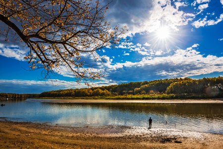 Autumn Sunny landscape on the river, fishing weather. Ob river, Verkh-Suzun, Suzun district, Novosibirsk region, Western Siberia, Russiaのeditorial素材