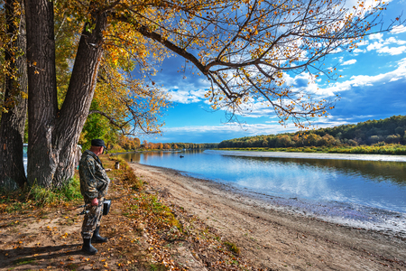 Ob river, Verkh-Suzun, Suzun district, Novosibirsk region, Western Siberia, Russia-September 22, 2018: fisherman with spinning on autumn riverのeditorial素材