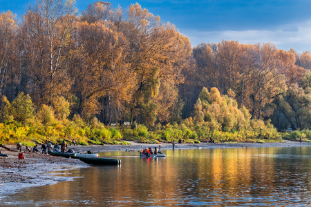 Ob river, Verkh-Suzun, Suzun district, Novosibirsk region, Western Siberia, Russia-September 22, 2018: fishermen with inflatable boats preparing to sailのeditorial素材