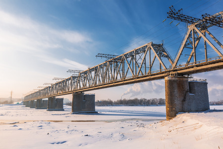 Novosibirsk, Western Siberia, Russia-January 2, 2019: Railway bridge at the intersection of the main course of the TRANS-Siberian railway with the Ob river, view from the Mikhailovskaya embankmentのeditorial素材