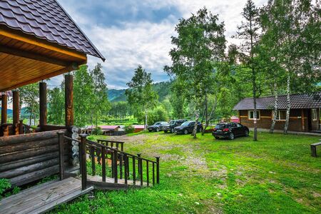 Chuyskiy trakt, Shebalinskiy district, Altai Republic, southern Siberia, Russia - July 13, 2019: the cafe-hotel for tourists with the name "Barsugan" at the mouth of the barsugan Riverのeditorial素材