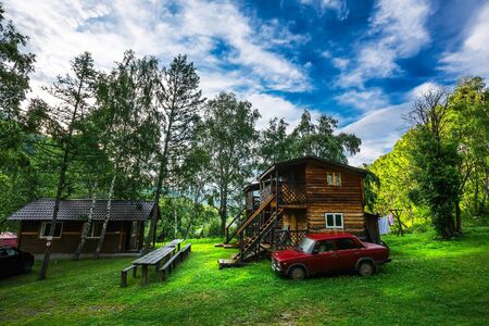 Chuyskiy trakt, Shebalinskiy district, Altai Republic, southern Siberia, Russia - July 13, 2019: the cafe-hotel for tourists with the name "Barsugan" at the mouth of the barsugan Riverのeditorial素材