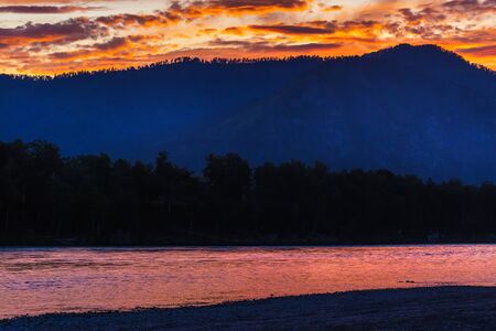 Katun river with beautiful clouds during the summer sunset.Chemalsky district, Altai Republic, South Siberia, Russiaの写真素材