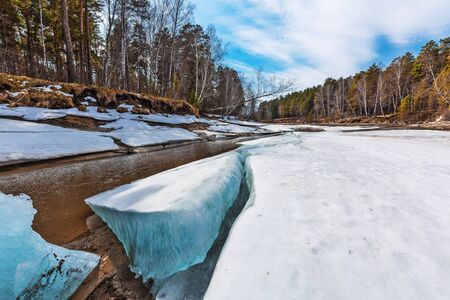 Spring melting of ice on the river. Razdelnaya river, Berdsk, Novosibirsk oblast, Western Siberia, Russiaの写真素材