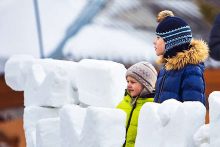 Berdsk city, Novosibirsk region, Western Siberia, Russia-March 1, 2020: Children on the snow fortress on the Maslenitsa holidayのeditorial素材