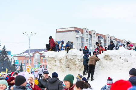 Berdsk city, Novosibirsk region, Western Siberia, Russia-March 1, 2020: Children on the snow...
