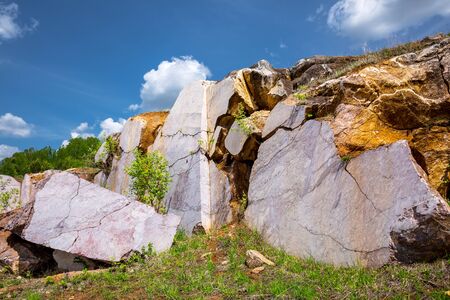 Stone blocks of pink marble in the quarry for its extraction. Peteni village, Maslyaninsky district,...