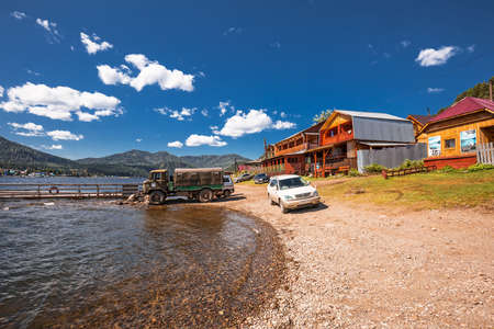 Artybash village, Turochaksky district, Altai Republic, Russia-August 20, 2020: private buildings on the shore of lake Teletskoyeのeditorial素材