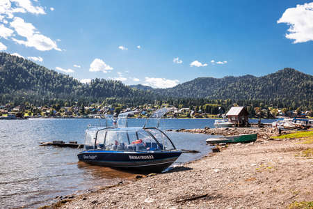 Artybash village, Turochaksky district, Altai Republic, Russia-August 20, 2020: Pier and pleasure boats in the village of Artybash on lake Teletskoyeのeditorial素材