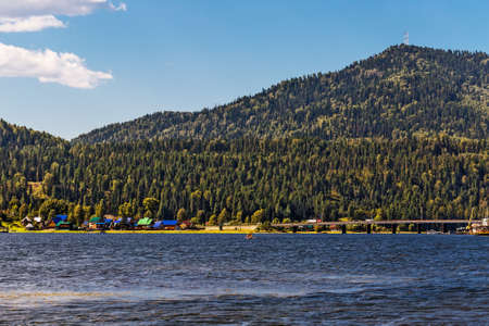 View from Teletskoye lake on the source of the Biya river and the road bridge over the river.の写真素材