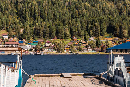 Iogach village, Turochaksky district, Altai Republic, Russia-August 20, 2020: View from the pier in the village of iogach to the village of Artybashのeditorial素材