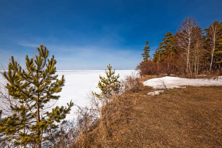 The coast of the Ob Sea in the spring. Berdsk, Novosibirsk region, Western Siberia - April 11, 2021の写真素材
