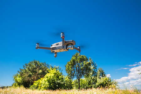 BERDSK, Novosibirsk Region, Western Siberia of Russia-July 8, 2021: a soaring quadcopter over the...