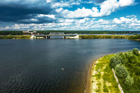 BERDSK, Novosibirsk Region, Western Siberia of Russia - July 28, 2021: Highway and railway bridge over the Berd River in summerのeditorial素材