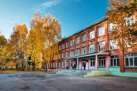 The city of Berdsk, Novosibirsk region, Western Siberia of Russia - October 9, 2021: autumn cityscape with trees and fallen yellow leavesのeditorial素材