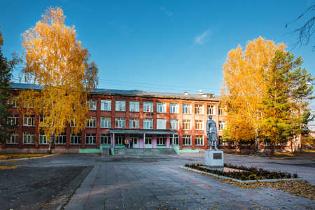 The city of Berdsk, Novosibirsk region, Western Siberia of Russia - October 9, 2021: autumn cityscape with trees and fallen yellow leavesのeditorial素材
