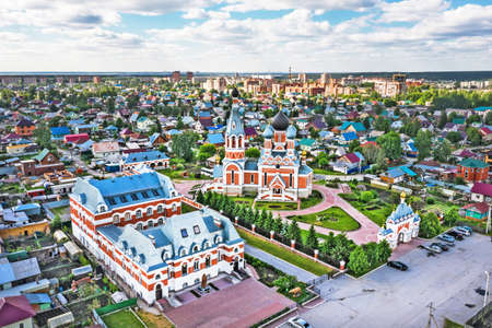 BERDSK, Novosibirsk Region, Western Siberia of Russia - June 6, 2021: Transfiguration Cathedral of the Novosibirsk and Berdsk Diocese among urban buildings, from a bird's-eye viewのeditorial素材