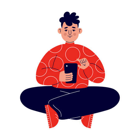 A young man in a red sweater sits on the floor and works with the phone on social networks.のイラスト素材