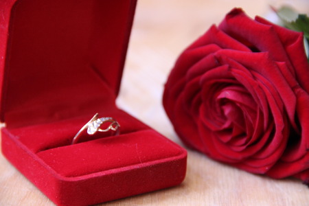 A beautiful gold ring in a red box.の写真素材