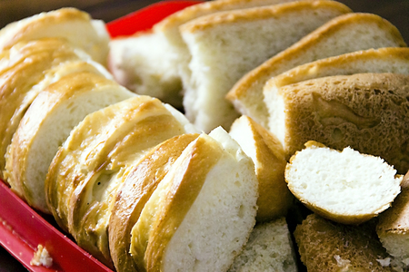 Pictured in the photo sliced white bread on the old table
