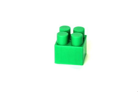 pictured in the photo Wall from Plastic building blocks isolated on white background.