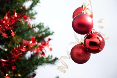 Red hanging Christmas ball and Christ treeの写真素材