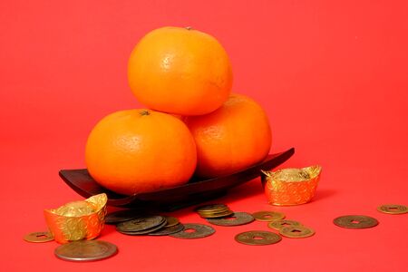 Orange for lunar Chinese new year, three oranges mean earn in Chinese culture lucky numberの写真素材