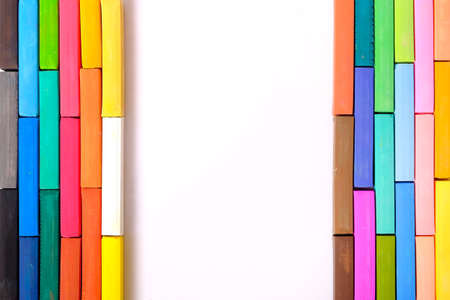 colourful chalk pastel on white background with space for textの写真素材