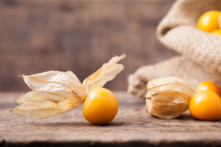 Close up of cape gooseberry on wooden backgroundの写真素材
