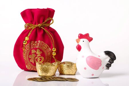 Rooster chinese zodiac 2017 with red money bag, gold and chinese coins on white background as New year concept.の写真素材