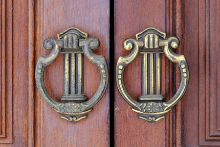 Close up wooden door and metal door knocker chinese style architecture.