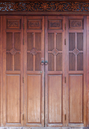 Wooden door and metal door knocker chinese style architecture.の写真素材